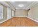 Open basement area with wood-look floors, bright windows and neutral walls, offering a blank canvas for customization at 1654 Summersweet Ln, Dacula, GA 30019