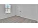 Bright bedroom featuring neutral carpet and a window allowing natural light to flood the room at 1654 Summersweet Ln, Dacula, GA 30019