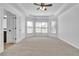 Bright and airy bedroom with neutral carpet, bay windows and a ceiling fan at 1654 Summersweet Ln, Dacula, GA 30019