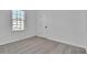 Bedroom with neutral walls and carpet, featuring a window and closet at 1654 Summersweet Ln, Dacula, GA 30019