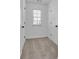 Walk-in closet with neutral carpet and natural light, offering ample space for storage and organization at 1654 Summersweet Ln, Dacula, GA 30019