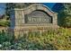 Stone entrance sign for Hamilton Mill - Windridge, surrounded by manicured landscaping at 1654 Summersweet Ln, Dacula, GA 30019