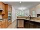 Bright kitchen features granite countertops, stainless steel appliances, and ample cabinet space at 1654 Summersweet Ln, Dacula, GA 30019