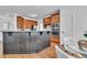 Stylish kitchen with wooden cabinets, stainless steel appliances, and a breakfast bar area at 1654 Summersweet Ln, Dacula, GA 30019