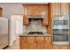 Kitchen boasts stainless steel appliances, granite countertops, and ample cabinet space at 1654 Summersweet Ln, Dacula, GA 30019