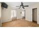 Bedroom with plywood flooring, ceiling fan and curtains at 3480 Beech Dr, Decatur, GA 30032