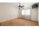 Bedroom with plywood flooring, ceiling fan and curtains at 3480 Beech Dr, Decatur, GA 30032