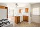 Well-lit kitchen featuring white countertops, bright cabinets, and modern appliances, open to the dining area at 3480 Beech Dr, Decatur, GA 30032