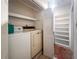 Laundry room with appliances and storage shelving at 3480 Beech Dr, Decatur, GA 30032