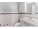 Bathroom with white subway tile, decorative accent tiles, and a modern sink at 430 Lindbergh Ne Dr # A1, Atlanta, GA 30305