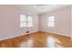 Bedroom with hardwood floors, two windows, and ceiling fan at 430 Lindbergh Ne Dr # A1, Atlanta, GA 30305