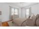 Staged bedroom featuring wood floors, two windows, and ceiling fan at 430 Lindbergh Ne Dr # A1, Atlanta, GA 30305