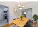 Staged dining room with wood floors, modern art, and vase of flowers at 430 Lindbergh Ne Dr # A1, Atlanta, GA 30305