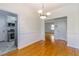 Bright dining room featuring hardwood floors, crown molding, and a modern light fixture at 430 Lindbergh Ne Dr # A1, Atlanta, GA 30305