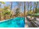 A backyard pool surrounded by trees and foliage at 430 Lindbergh Ne Dr # A1, Atlanta, GA 30305