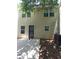 Cozy backyard space features a small patio, and a secure, decorative metal gate door at 5175 Hanover St, Atlanta, GA 30349