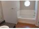 Bathroom with a bathtub and tile surround, complemented by a window and vanity at 5175 Hanover St, Atlanta, GA 30349