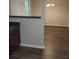 Open-concept dining room featuring dark laminate flooring at 5175 Hanover St, Atlanta, GA 30349