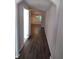 Hallway with laminate flooring leading towards the living area and front door at 5175 Hanover St, Atlanta, GA 30349