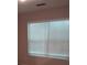 Double window covered with white blinds to let in natural light at 5175 Hanover St, Atlanta, GA 30349