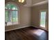 Bedroom with hardwood floors, large windows and ample natural light at 704 Euel Dr, Mcdonough, GA 30252