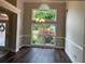 Elegant dining room boasting hardwood floors, large windows and decorative chandelier at 704 Euel Dr, Mcdonough, GA 30252