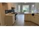 Bright eat-in kitchen with tiled floor and white cabinets at 704 Euel Dr, Mcdonough, GA 30252