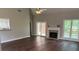 Bright living room with vaulted ceilings, fireplace, hardwood floors and backyard access at 704 Euel Dr, Mcdonough, GA 30252