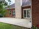 Back patio with sliding doors and brick columns for entertaining or relaxing outdoors at 704 Euel Dr, Mcdonough, GA 30252