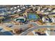 Aerial view showcases community amenities including a pool, tennis courts, and playground nestled amongst beautiful homes at 7630 Rambling Vale, Cumming, GA 30028