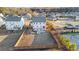 Expansive backyard featuring a fire pit, playground, and tennis court, perfect for outdoor activities and entertaining at 7630 Rambling Vale, Cumming, GA 30028