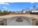 Spacious backyard with a circular fire pit, perfect for outdoor entertaining at 7630 Rambling Vale, Cumming, GA 30028