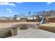 Wide backyard with firepit, playground set, and mature tree line views at 7630 Rambling Vale, Cumming, GA 30028