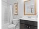 Well-maintained bathroom with a vanity, toilet, and shower/tub, offering a clean and functional space at 7630 Rambling Vale, Cumming, GA 30028