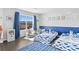 bedroom with two twin beds, bean bag chairs, and a large window at 7630 Rambling Vale, Cumming, GA 30028