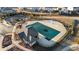 An aerial view of a covered community pool and playground in the neighborhood at 7630 Rambling Vale, Cumming, GA 30028