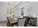 Dining room with coffered ceilings, modern lighting, hardwood floors, and stylish decor at 7630 Rambling Vale, Cumming, GA 30028