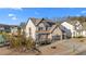 Charming two-story home featuring a stone facade, covered front porch, and an attached two-car garage at 7630 Rambling Vale, Cumming, GA 30028