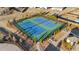 Aerial view of community tennis courts with well-maintained landscaping at 7630 Rambling Vale, Cumming, GA 30028