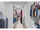 Spacious walk-in closet with custom shelving, rod system, and organization at 7630 Rambling Vale, Cumming, GA 30028