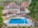 Aerial view of a backyard featuring a pool and patio at 3140 Sawnee Lake Trl, Cumming, GA 30040