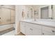 Bathroom featuring a vanity, walk-in shower and toilet combo with hexagon tile flooring at 3140 Sawnee Lake Trl, Cumming, GA 30040