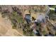 Aerial view of the house with a large driveway in a wooded neighborhood at 935 Tiber Cir, Alpharetta, GA 30022