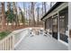 Relax on the charming back porch with chairs and an inviting fire pit at 935 Tiber Cir, Alpharetta, GA 30022