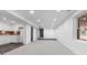 Finished basement with an open floor plan and recessed lighting, perfect for entertaining at 935 Tiber Cir, Alpharetta, GA 30022