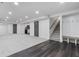 Finished basement with ample space, neutral carpet, and access to other rooms at 935 Tiber Cir, Alpharetta, GA 30022