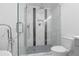 Modern bathroom with stylish fixtures, glass shower, and tiled walls at 935 Tiber Cir, Alpharetta, GA 30022