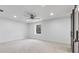 Bright bedroom with a ceiling fan, recessed lighting, and a scenic window view at 935 Tiber Cir, Alpharetta, GA 30022