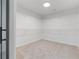 Spacious walk-in closet features wire shelving for optimal organization at 935 Tiber Cir, Alpharetta, GA 30022