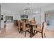 Open concept dining area showcasing modern decor and hardwood floors at 935 Tiber Cir, Alpharetta, GA 30022